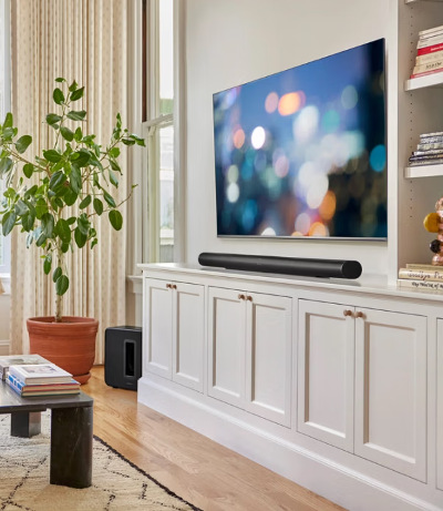 Sonos Arc Ultra positioned below TV with Sonos SUB