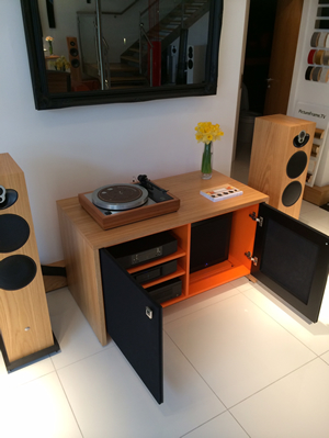 Audio Cabinet Tamzin 2 Bay equipment cabinet with Orange insides. Black grille cloth doors allow heat, your infra-red remote commands and the sound from the front-firing KEF T2 Subwoofer (shown) to pass through closed doors.