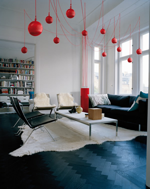 Elipson Sound Tree in a domestic Living Room with 12 red Speakers