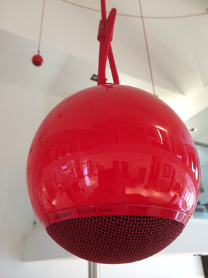 Elipson Sound Tree installed in our Showroom showing 1 of the 12 gloss red fruits (speakers) connected via a red fabric coated speaker cable