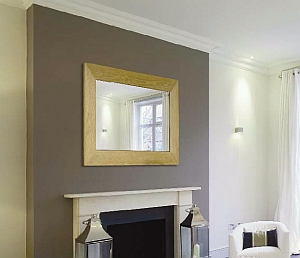 Room shot showing 42" Mirror Media TV installed above a fireplace