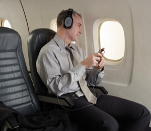 PSB M4U 2 Noise Cancelling Headphones being used on an aircraft.